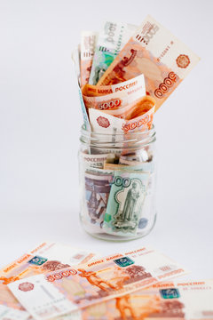Russian rubles in jar on white background. Close up. Loan, mortgage, credit, deposit concept