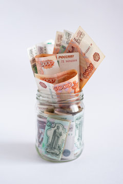 Russian money in glass jar. Loan, mortgage, credit, deposit concept. Close up