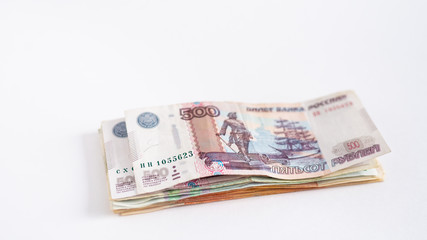 Stack of russian money, rubel banknotes on white background. Loan, mortgage, credit concept, copy space