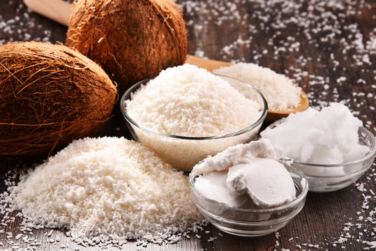 Composition with bowl of shredded coconut and shells