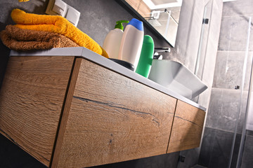 Plastic bottles of body care and beauty products in the bathroom