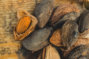 Almonds on wooden board from above