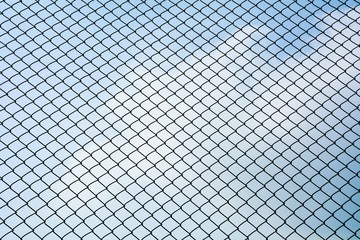 Fototapeta premium Texture the cage metal net isolate on blue sky