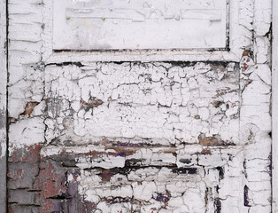 Texture of cracked paint on the old white door