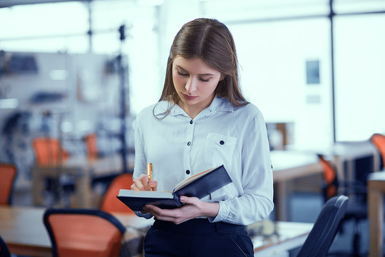 Businesswoman with notepad