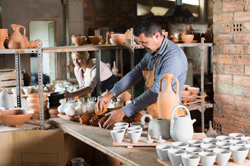 Two craftsmen with ceramic