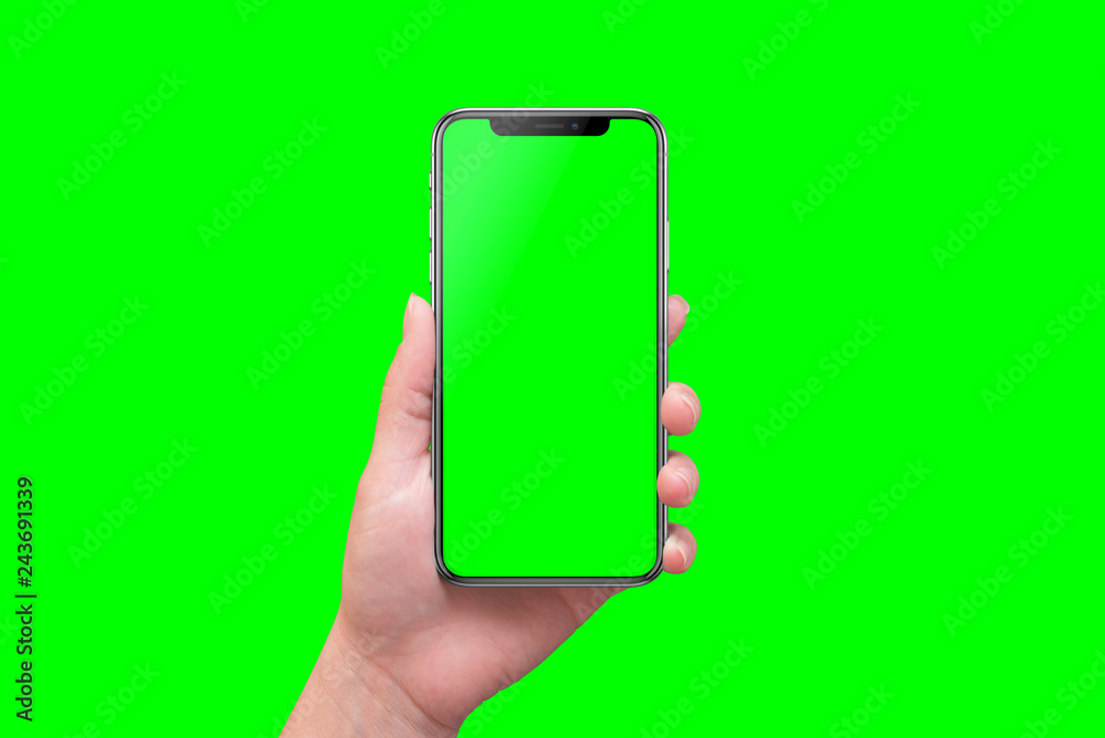 Poster Modern smart phone in hand close-up. Isolated screen and background in green.