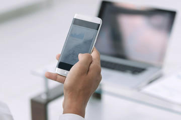 close up. business men using a modern smartphone