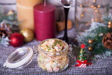 Traditional New Year and Christmas Russian salad Olivier (olivie) in a jar. Close-up, selective focus.