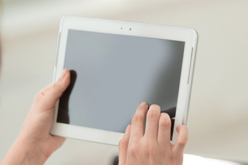 close up. businesswoman pushing using digital tablet.