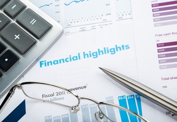 Pen, Glasses And Calculator On Financial Reports Close-up