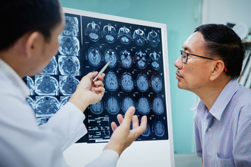 doctor give advice to elderly patient about MRI (Xray) brain Scans
