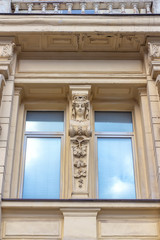 Window with female sculpture