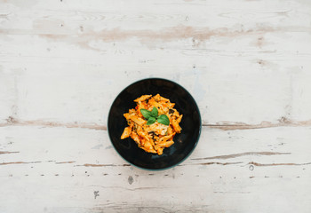 Penne gratin with vegetables, grilled zucchini and marinated tomatoes