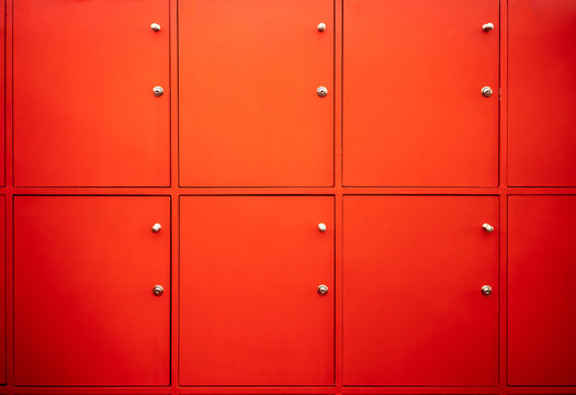Red locker room with closed doors. Free service in fitness.