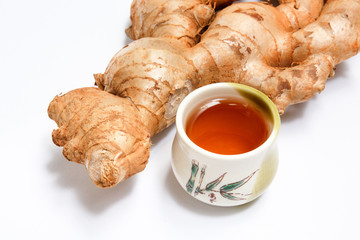 Whole fresh ginger root, a traditional asian and chinese healthy food ingredient and medicine on white background,tea