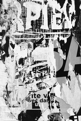 Fototapeta premium Old grunge ripped torn vintage collage posters creased crumpled paper surface texture background backdrop placard advertising