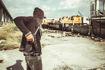 Gangster getting gun out his pants before attacking truck stop