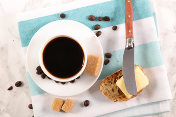 coffee cup with bread and butter