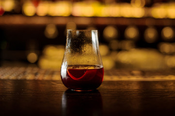 Elegant cocktail glass filled with fresh bitter sweet red cocktail