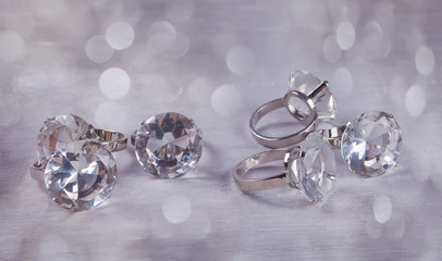 Silver big wedding rings on a grey background with boke