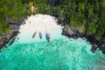 adventure style hi season thai and foreign tourists long tail boat and driving see coral  on phi phi island kra bi Thailand aerial top view from drone - obrazy, fototapety, plakaty