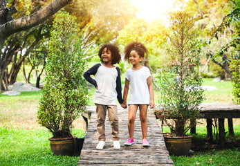 Fototapeta premium Children playing in the garden in summer day