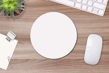 Mouse pad mockup. Round white mat on the table with props, mouse and keyboard