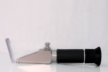 Refractometer on white surface