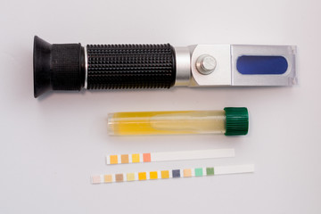 urine sample, refractometer and urinary strips