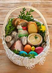 Traditional Easter basket with food - obrazy, fototapety, plakaty