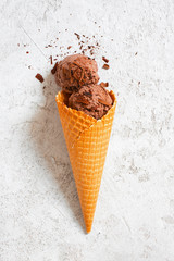 Balls of chocolate ice cream in the waffle cone