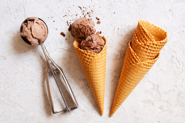 Balls of chocolate ice cream in the waffle cone