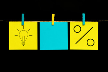 Copy space. Three stickers. The lamp is drawn on the yellow sheet as a symbol of the idea and...