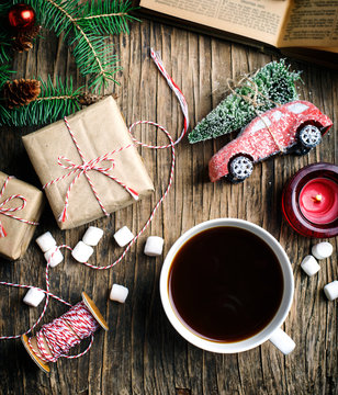 Overhead view of a cup of coffee, Christmas gifts and decorations