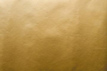 Golden gift wrap paper background or texture