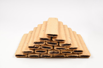 Waffle bar with jam isolated on white. Pyramid of waffers.