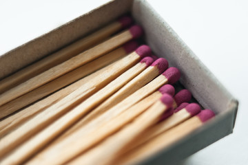 red matches in box. white background. close up shot