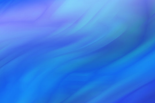 Abstract colored background in blue tones. Background of wavy blue stripes