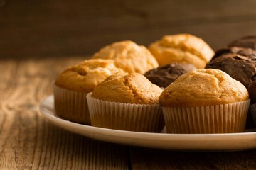 Chocolate cake and nut cake, homemade cakes on wooden background