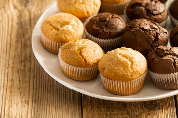 Chocolate cake and nut cake, homemade cakes on wooden background