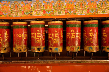 Rotating Prayer wheels with inscriptions on them