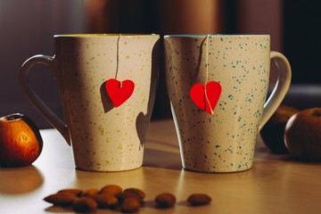 two tea cups with hearts