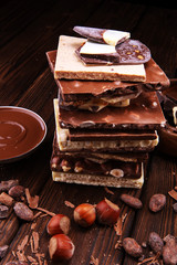 Chocolate bars on table with chocolate tower.
