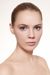 Fototapeta premium Portrait of young beautiful girl with clean make-up