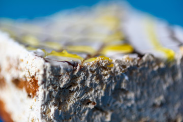 Sponge cake on a wooden background photographed close-up.