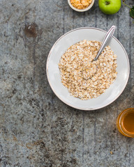 oatmeal, oat flakes, coffee for breakfast (table set). Top Food background