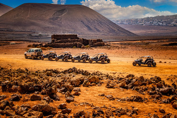 Several buggies are in line on Wonderful desert landscape.