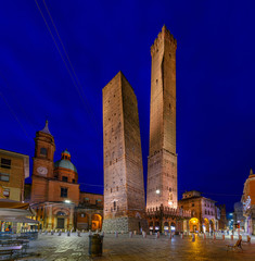 The most famous of the towers of Bologna are the central "Due Torri" (Asinelli and Garisenda) in Bologna at night, Emilia Romagna, Italy © Ekaterina Belova