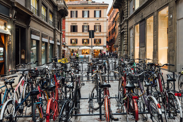 Old narrow street with parking of bicycles in Bologna, Emilia Romagna, Italy - obrazy, fototapety, plakaty